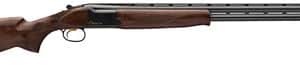 Wooden shotgun with dual barrels, side view.