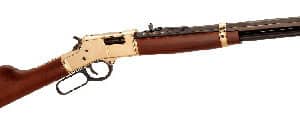 Lever-action rifle with wooden stock and brass finish.