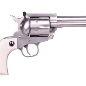 Silver revolver with ivory handle, side view.