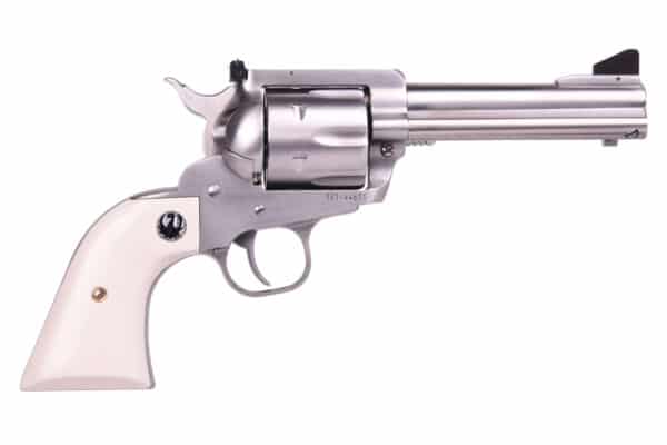 Silver revolver with ivory handle, side view.