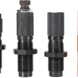 Four metal reloading dies of different types.