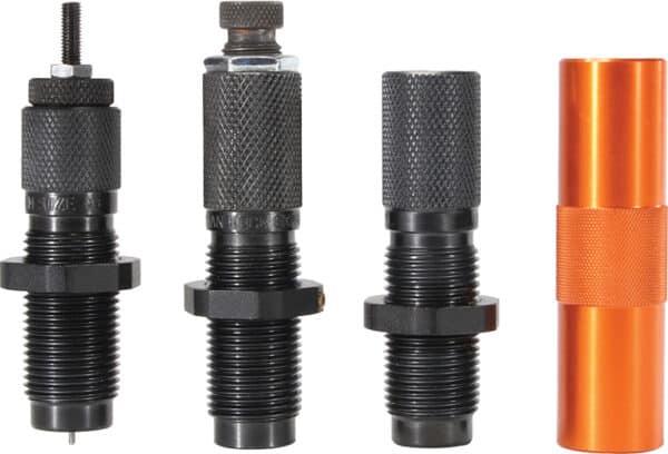 Four metal reloading dies of different types.