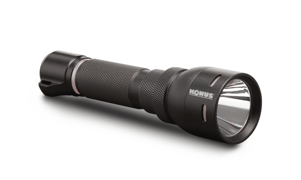 Black tactical flashlight with textured grip.