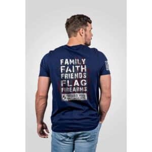 Man in navy graphic t-shirt with text.