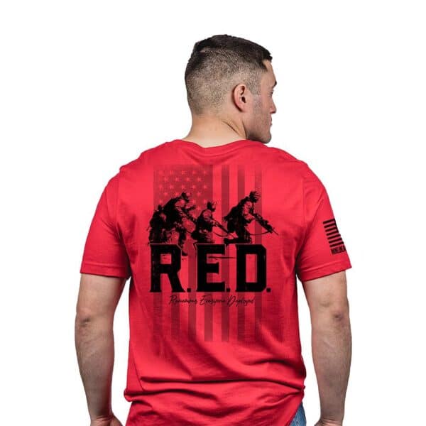 Red shirt with military design and flag graphic.