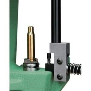 Reloading press with brass bullet case.