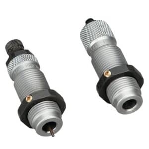 Two silver reloading dies on white background