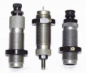 Three metal reloading dies for ammunition reloading.