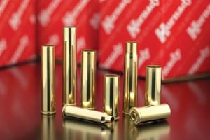 hdy8600 brass 1.jpg Brass bullet casings on reflective surface.