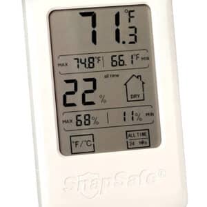 Digital hygrometer showing temperature and humidity levels.