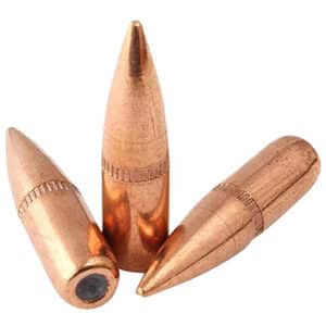 Three copper bullets on white background