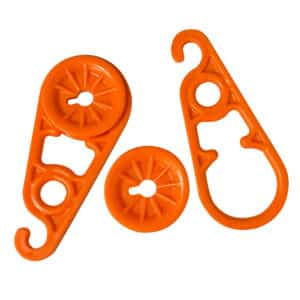 Orange plastic hooks for hanging items.