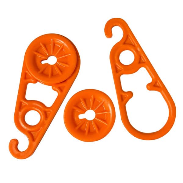 Orange plastic hooks for hanging items.