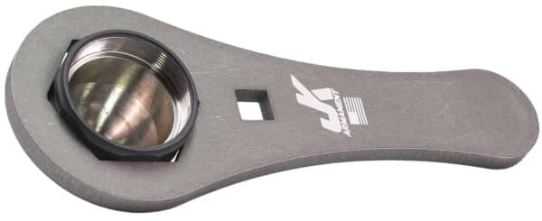 Metal tool with threaded cylindrical opening.