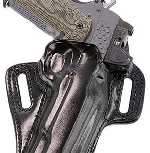 Pistol holstered in black leather gun holder