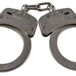 Silver handcuffs on white background