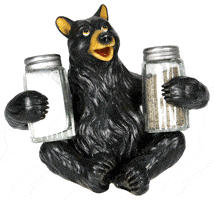 Black bear holding salt and pepper shakers