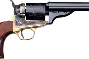 Antique revolver with wooden grip on white background.