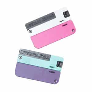 Two colorful folding Lifecard pocket guns.