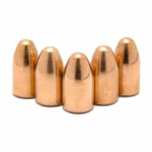 Five copper bullets on white background.