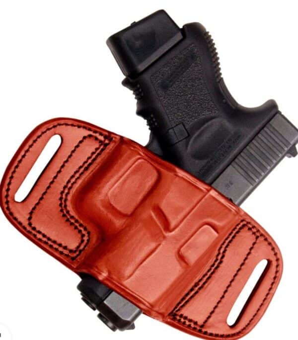 Black handgun in brown leather holster