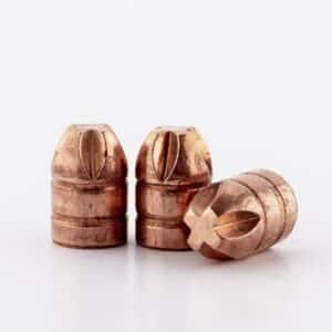 Three copper bullet casings on white background.