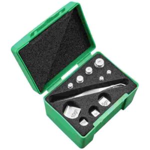 Green box with weight calibration set and tools.