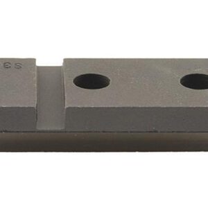 Gray metal spacer block with two holes.