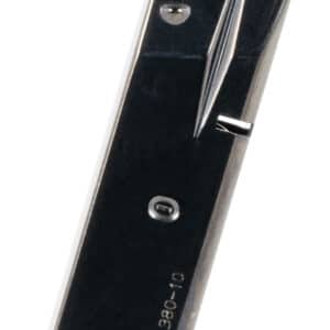 Black metal ammunition magazine standing upright.