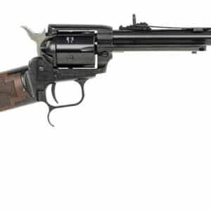 Rifle with engraved wooden stock and long barrel.