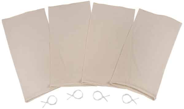 Four beige reusable produce bags with ties