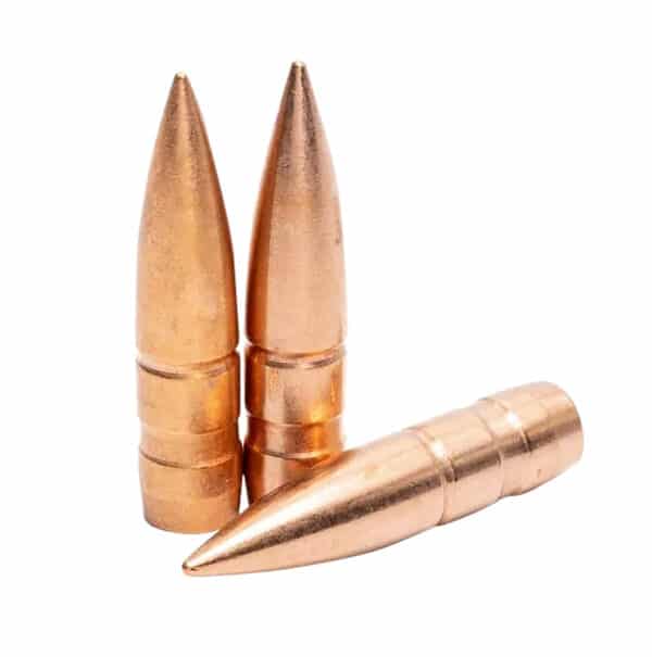 Three copper bullets standing and lying down.