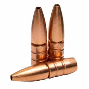 Three copper rifle bullets standing together