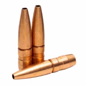 Three copper bullet casings on white background