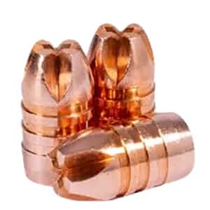 Copper bullets stacked on white background.