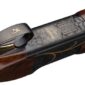 Engraved rifle with wood and metal detailing.