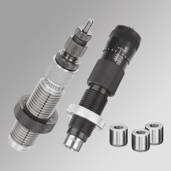 Precision reloading tools with bushings on gray background.