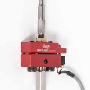 Red SwageSense tool with attached cable.