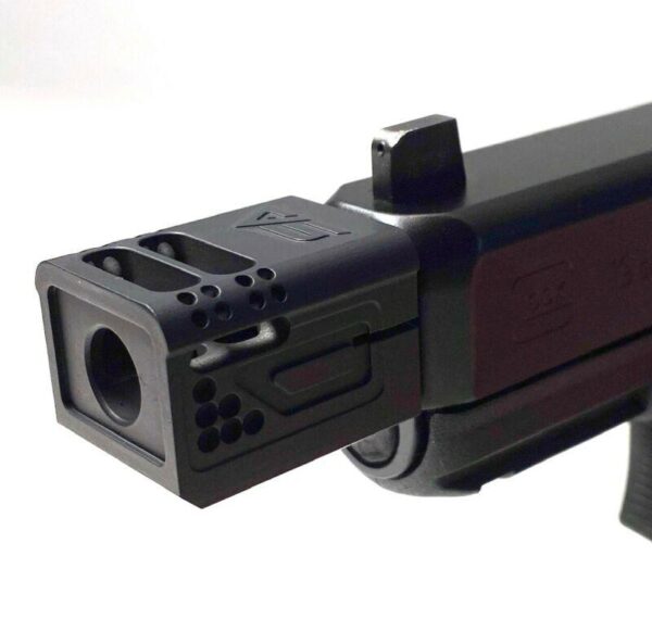Close-up of handgun muzzle brake attachment