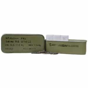 Two green ammunition boxes with labels and bullets.