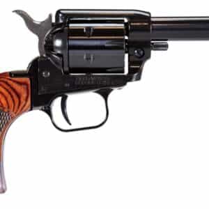 Close-up of vintage revolver gun with wooden handle.