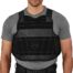 Man wearing black bulletproof vest, gray shirt.