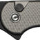 Black folding knife with textured handle