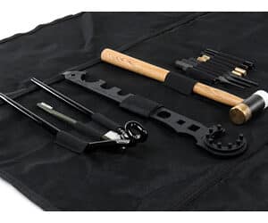 Collection of martial arts weapons on fabric background.