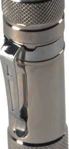 Stainless steel pocket flashlight with green button