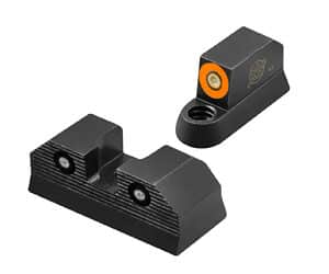 Pistol sights with colored indicators, close-up view.