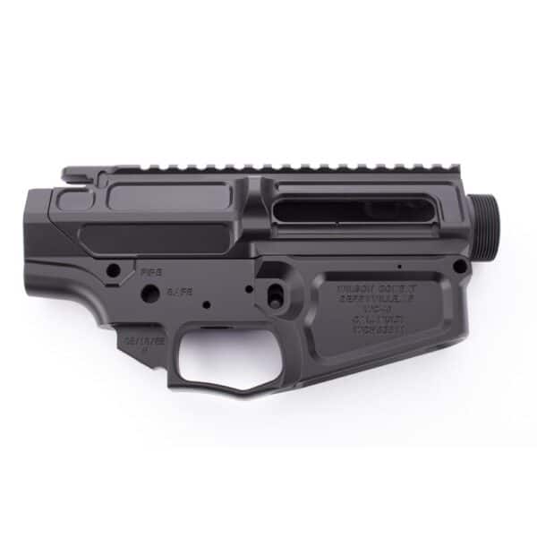 Black firearm lower receiver with engravings