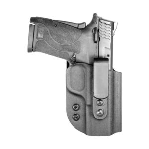 Pistol in holster, side view, isolated on white.