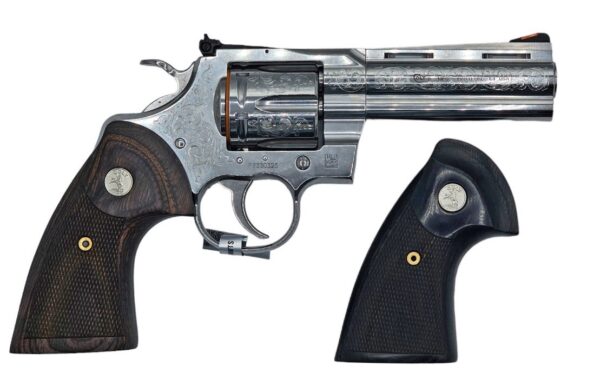 Engraved silver revolver with brown wooden grip.