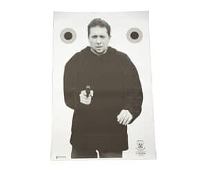 Shooting range target with person holding gun